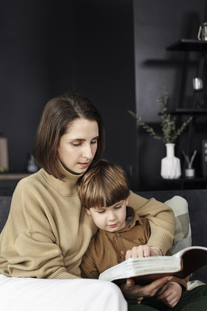medium-shot-woman-kid-reading-bible